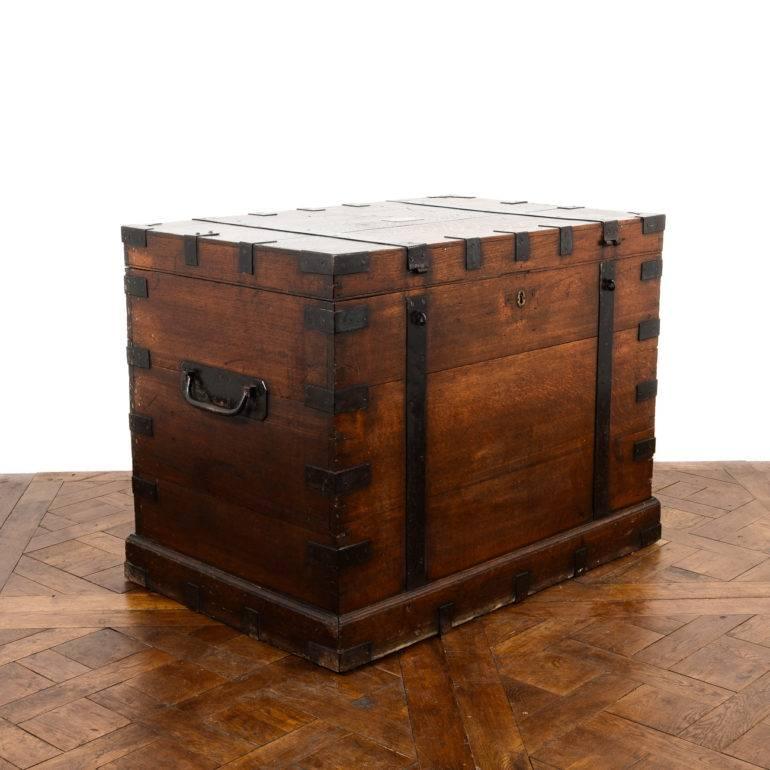 Antique English iron-bound solid oak ‘silver chest’ with thick iron plating and corners, and original massive wrought iron handles.
Fine dovetail joints to the corners and an overall warm color, Circa 1870.

Offers invited.
 