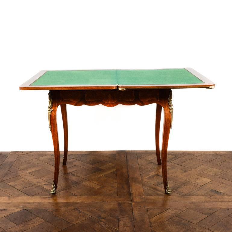 Highly inlaid antique Louis XV-style French 1920's games table. Beautiful marquetry and ormolu mounts.
