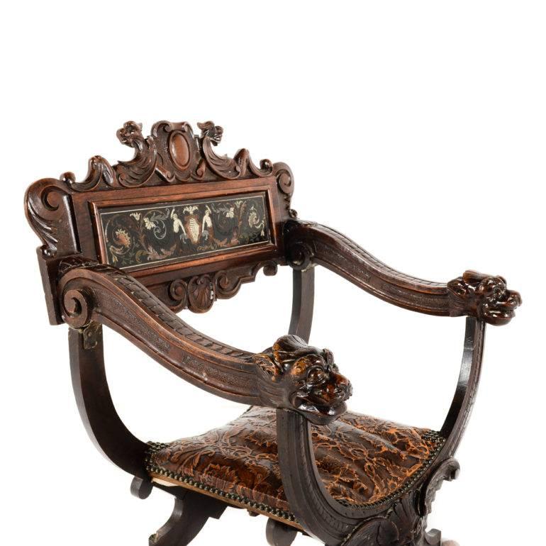 Fine quality carved-and-inlaid, 19th century Italian Savonarola chair, with original leather seat and ivory-inlaid carvings.
 