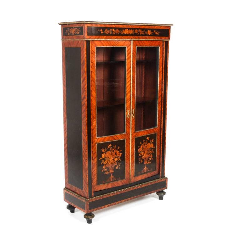 Fabulous quality and highly detailed two-door French 19th century vitrine from France. This is an exceptional piece with beautiful inlay and marquetry work.


 