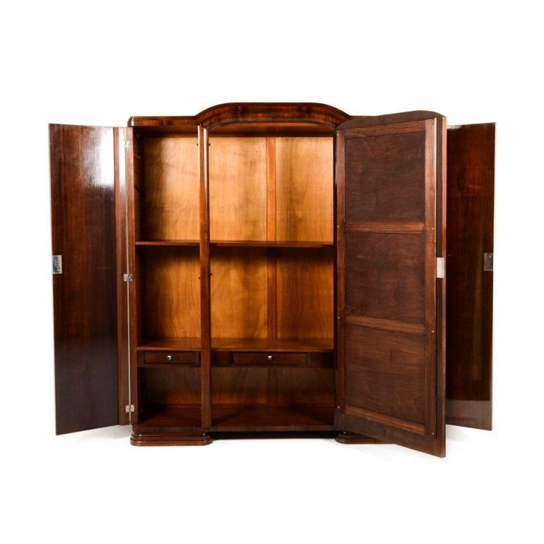 Antique French Art Deco three-door armoire with shelved interior. Gorgeous patina and fully finished interior, Circa 1930.
   