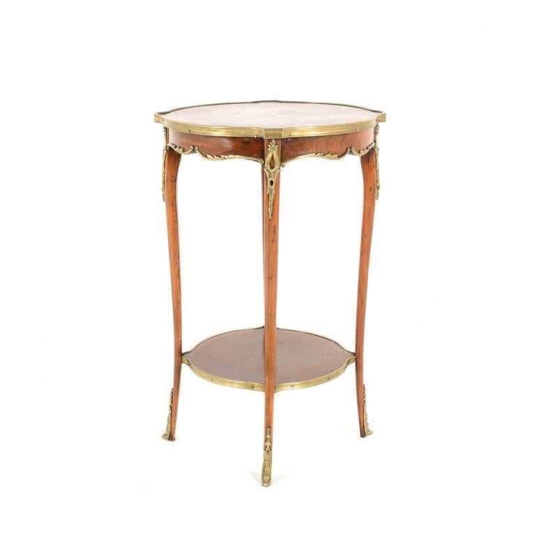 Antique French rosewood marble-top side table with gilt mounts. Graceful design to the legs, with a lower shelf for added strength. Circa 1900.


 