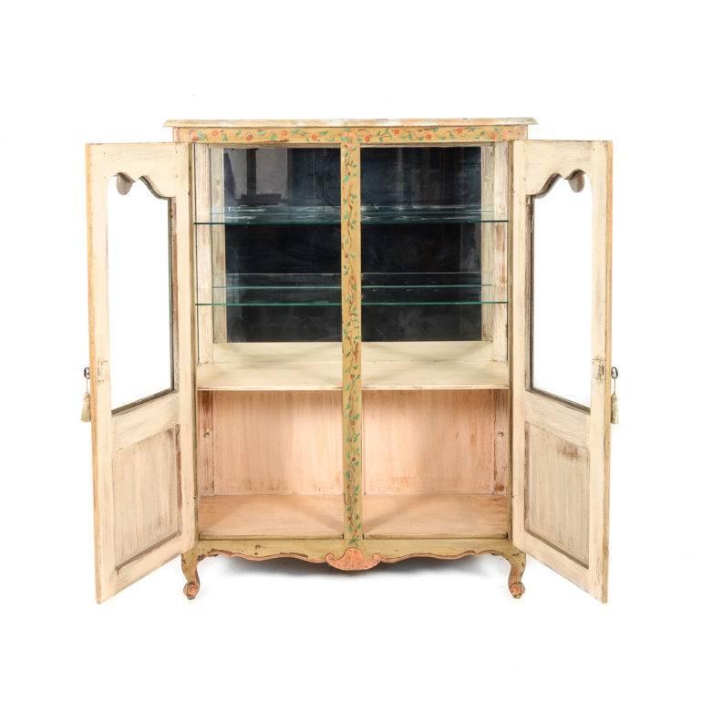 Original paint on this beautifully decorative two-door early 20th century antique French display case. 

