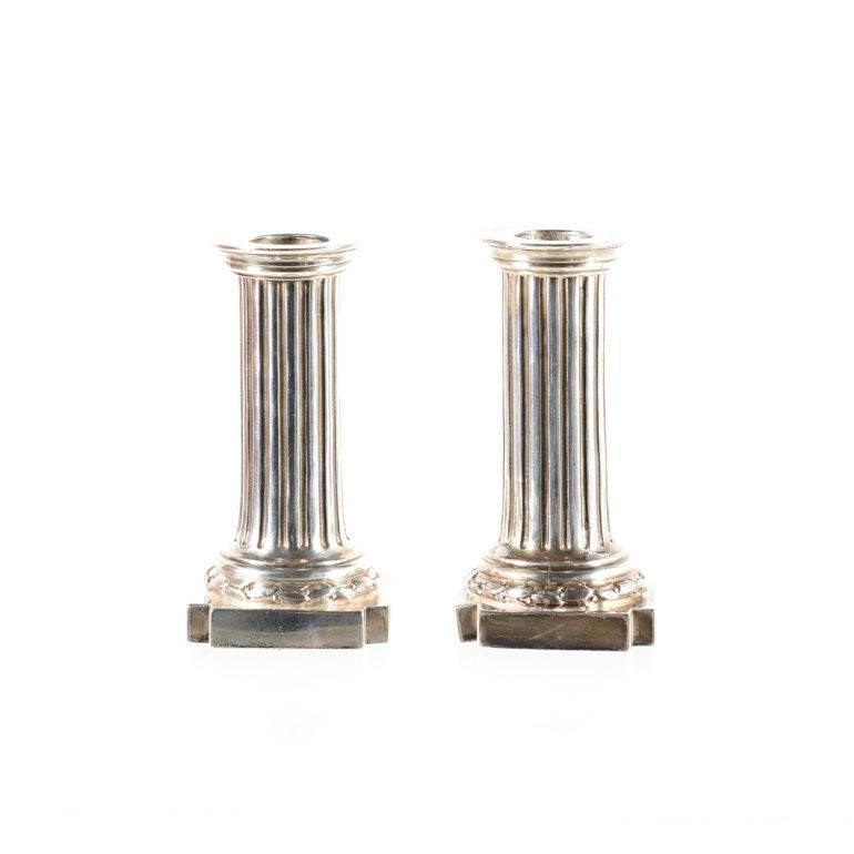 Clearly stamped and marked by renowned English silversmith, Robert Dicker these beautiful Georgian style candlesticks are perfect size for any table. Measures: 3