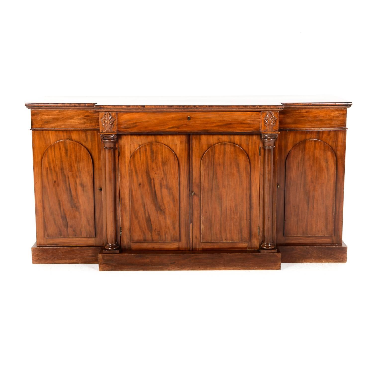 Antique English mahogany breakfront sideboard, circa 1870. Classic Victorian lines on this lovely piece. Shallow enough to make it very versatile throughout the home.





