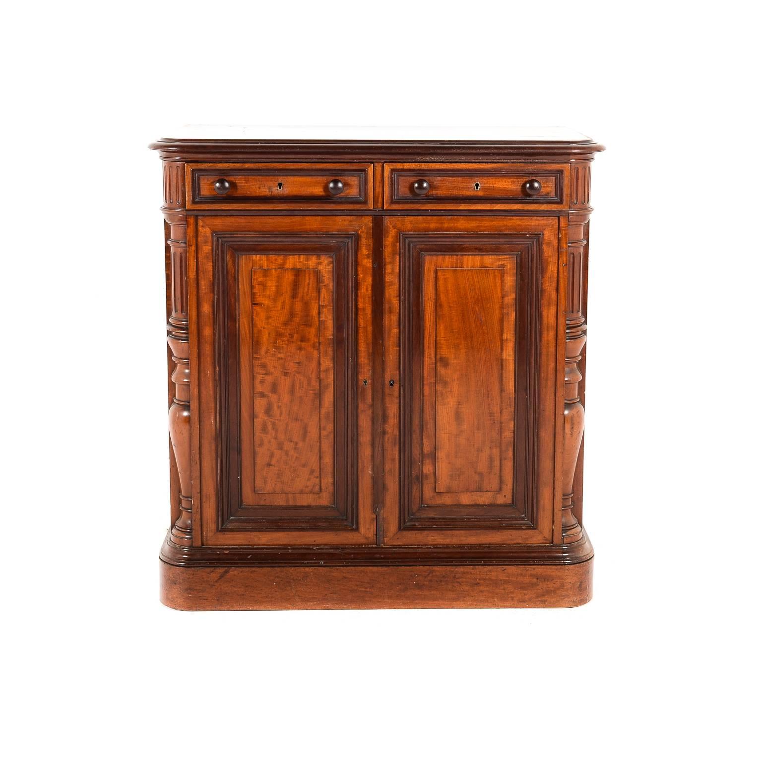 Antique Victorian mahogany two-door cabinet, circa 1880. Beautiful classical lines on this lovely piece. Its smaller size makes it very versatile around the home's entryway or hallway, dining room, even the boudoir.





         