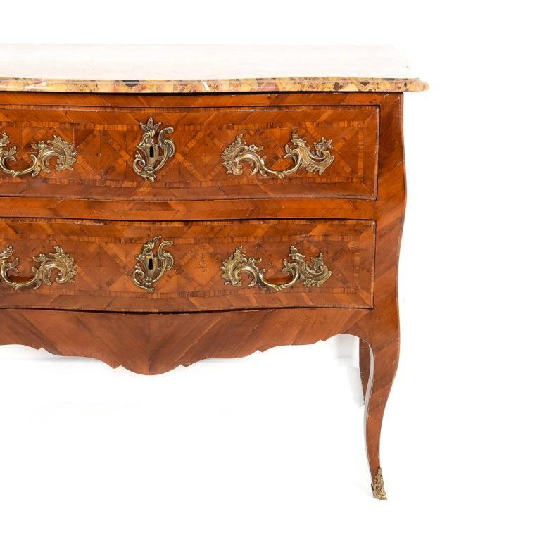 Antique period Louis XV commode, circa 1720. Beautiful mahogany piece in excellent condition, with impressively-designed ormolu mounts like only the French could produce. Marble top in a gorgeous complementary color.




  
 