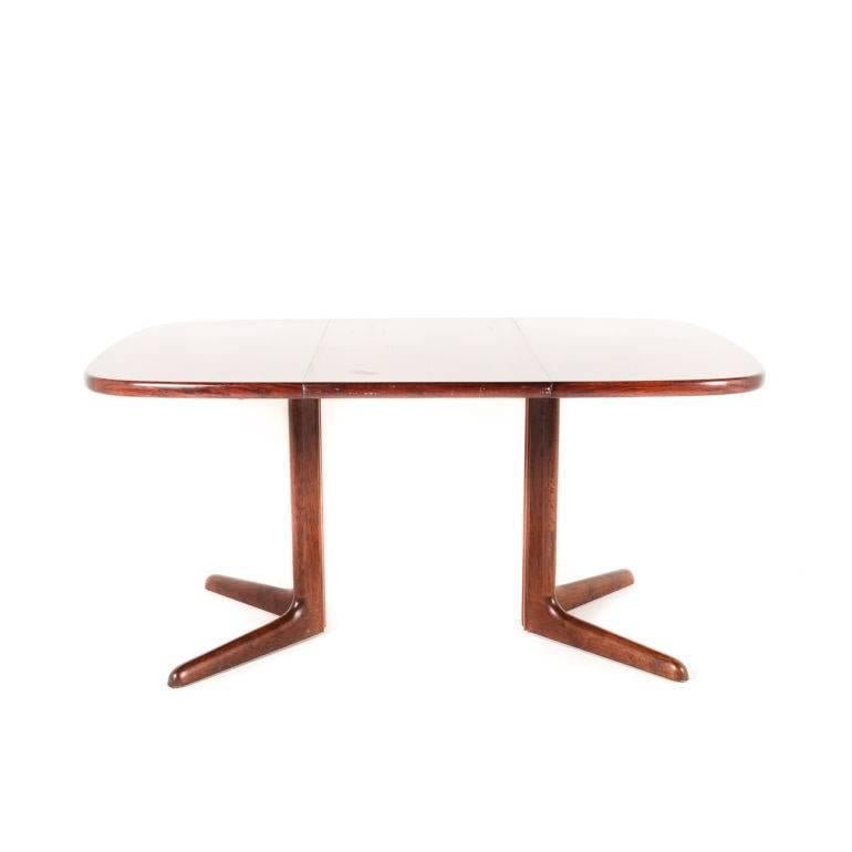 Vintage Danish rosewood dining table with one removable leaf. Labelled from Denmark. A perfect example of Danish Modern design crisp and understated, circa 1960.

Measures: 39.5” wide (closed) x 59.5” wide (open). 



          