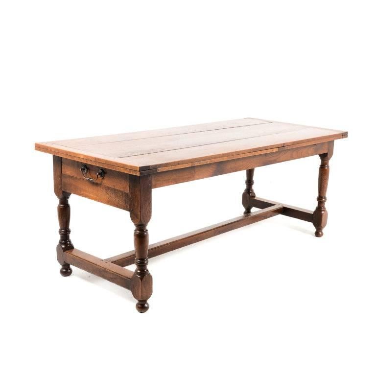 Antique French oak farm table with a single leaf and convenient end-drawer. In excellent condition, with a lovely patina, circa 1900.

Measures: 73” wide (closed) x 105” wide (open).

Offers invited.

 