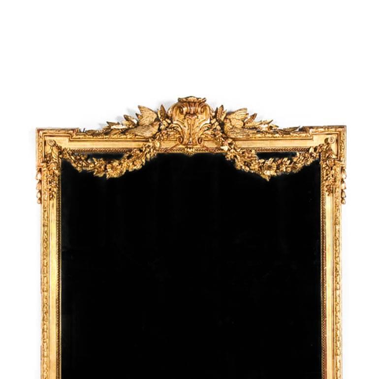 Impressive French mirror, circa 1875. Gilding and carving are intricate and gorgeous. At almost a full six feet in height, this beauty would be the focal point for that special room in your home. 





 