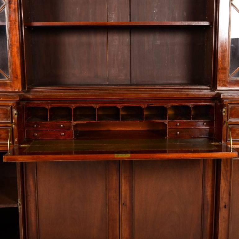 English mahogany breakfront bookcase with fitted secretaire. 





 