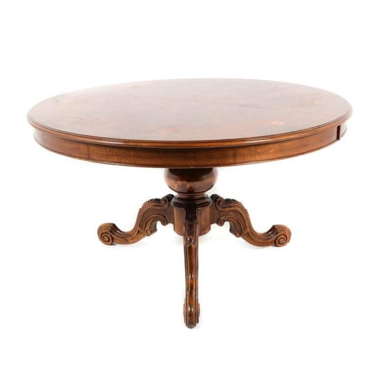 Italian carved base marquetry-top round table. Made of walnut, with multiple exotic wood inlays on the top. From the middle of the 20th century, with gorgeous carving and workmanship throughout.




  