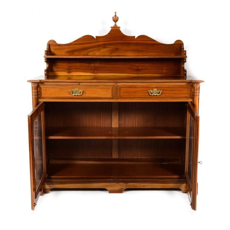 Antique mahogany buffet, circa 1900. This lovely piece is relatively narrow, making it a good candidate for a number of rooms in the home: the entryway, the living room, dining room, even the boudoir. Would also serve as a stand for a television.