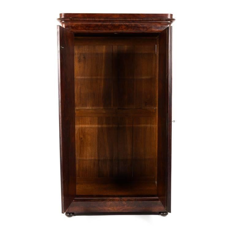 Antique French two-door flame mahogany Louis Philippe-style armoire, circa 1840. Of a regal height – over seven feet. The wood finish is very striking. (Custom shelves made gratis.)




 