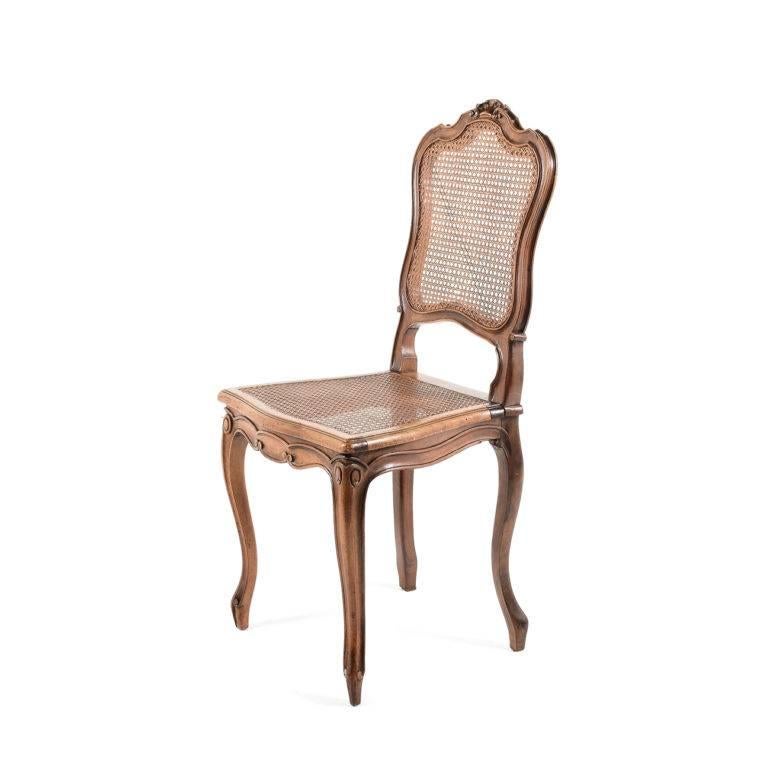 Caning Four French Louis XV Style Cane Walnut Dining Chairs. 