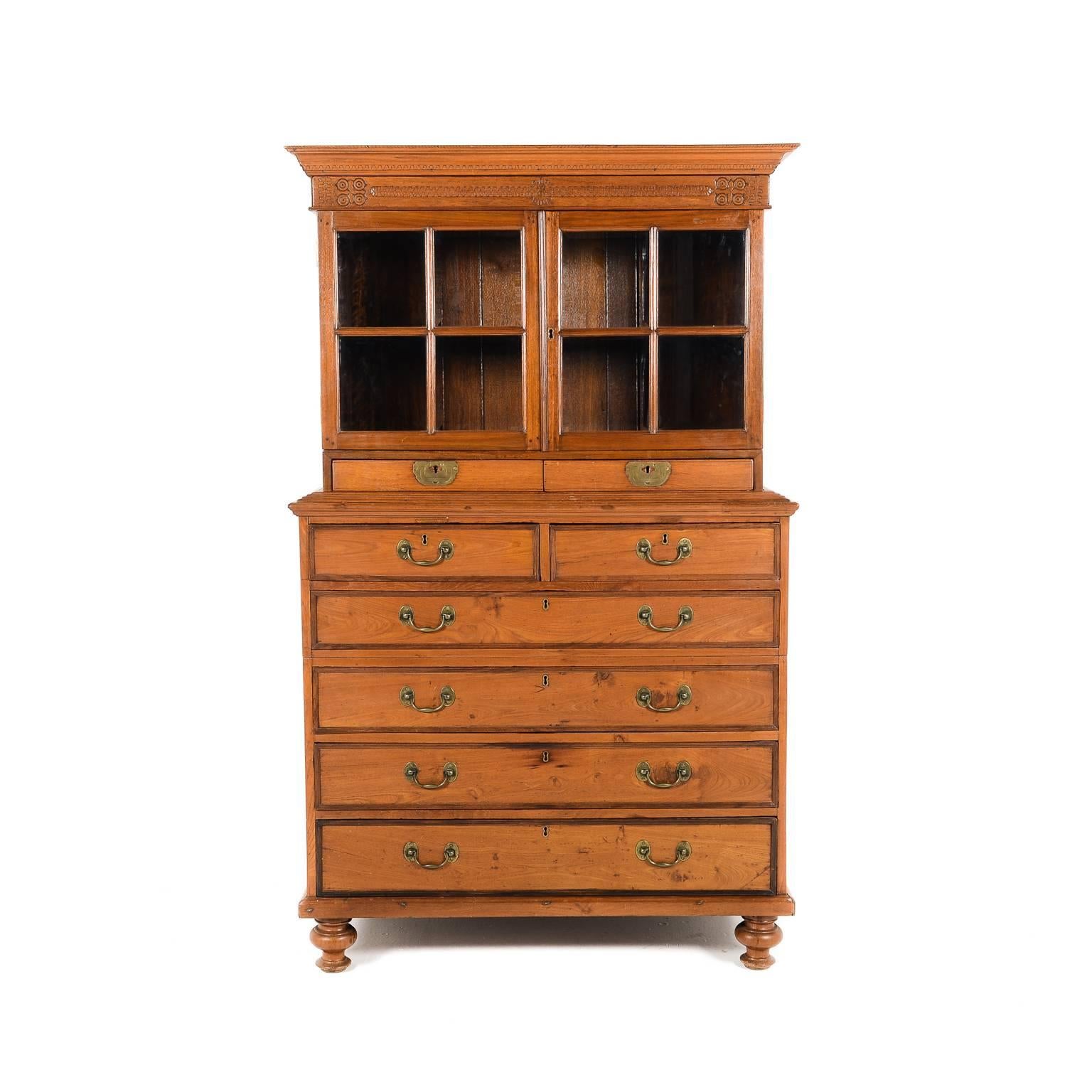 A rare Anglo-Indian colonial cabinet on chest, fitted with multiple drawers and an upper display portion. Likely a ‘Campaign’ piece, the chest separates into two sections and the upper cabinet lifts off for easier transport, circa 1870.






