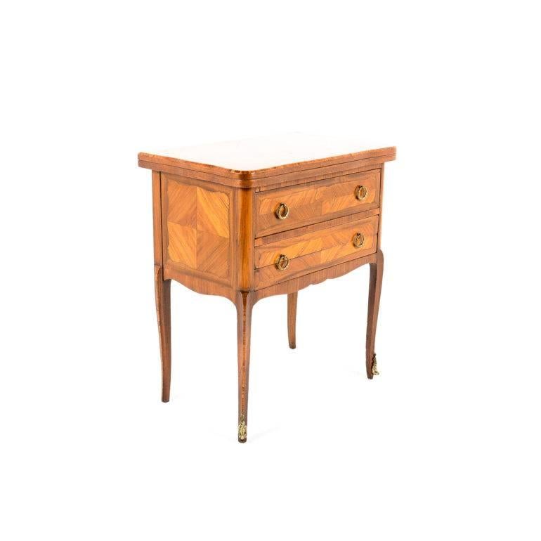 A fun and unusual piece, this French inlaid kingwood Louis XV-style games table features a fold-over, felt-lined playing surface, and a highly unusual fold-out drawer with backgammon and checkers/chess board. One conventional drawer above, circa