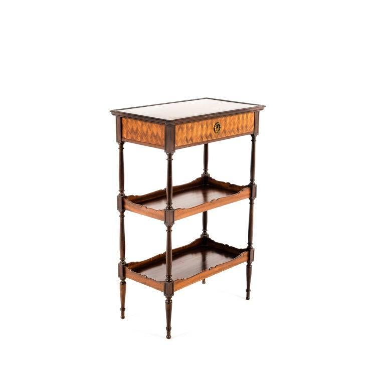 Lovely-quality French three-tier stand in mahogany with fine kingwood parquet top. Unusually-fine dovetail joinery and extra attention to details, such as the edges of the gallery and turned elements, suggest a top maker, although the piece is