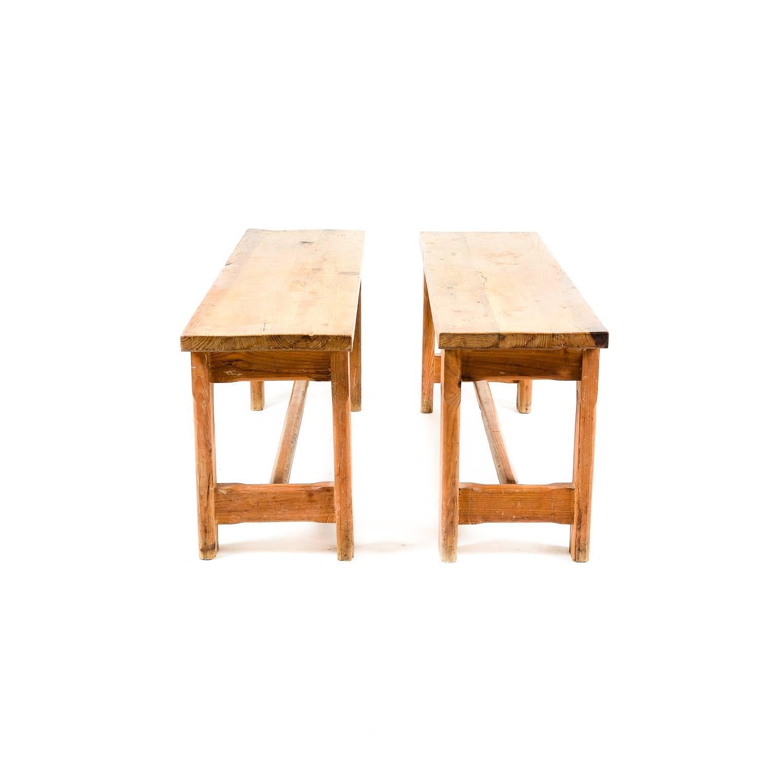 Antique early 20th Century pair of French solid pine benches. Sturdy and suitable for everyday use.





