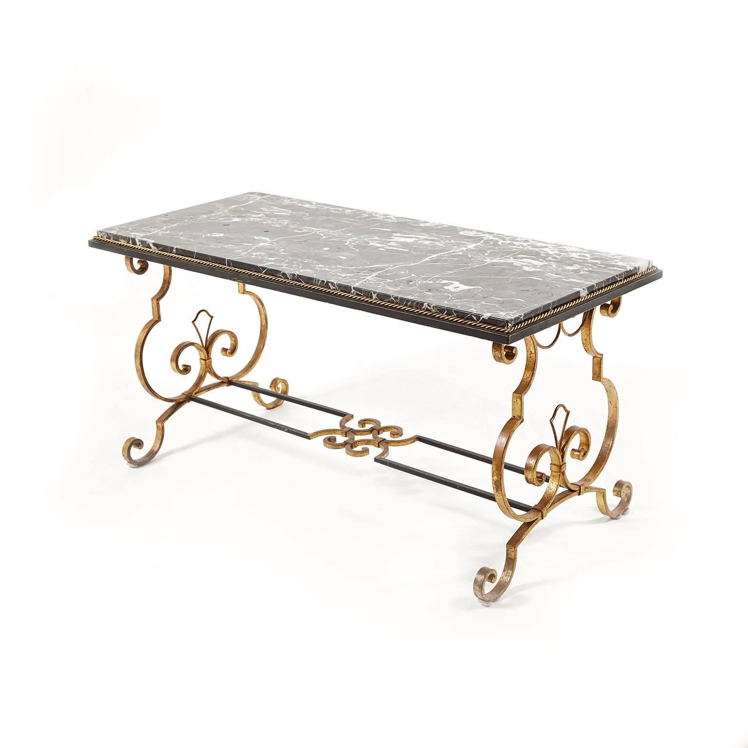 This beautiful Subes iron-and-bronze coffee table has fine detailing (note the fleur-de-lys) and unmistakable Subes Atelier scroll work, patina and detailing. From Paris, circa 1940. 


