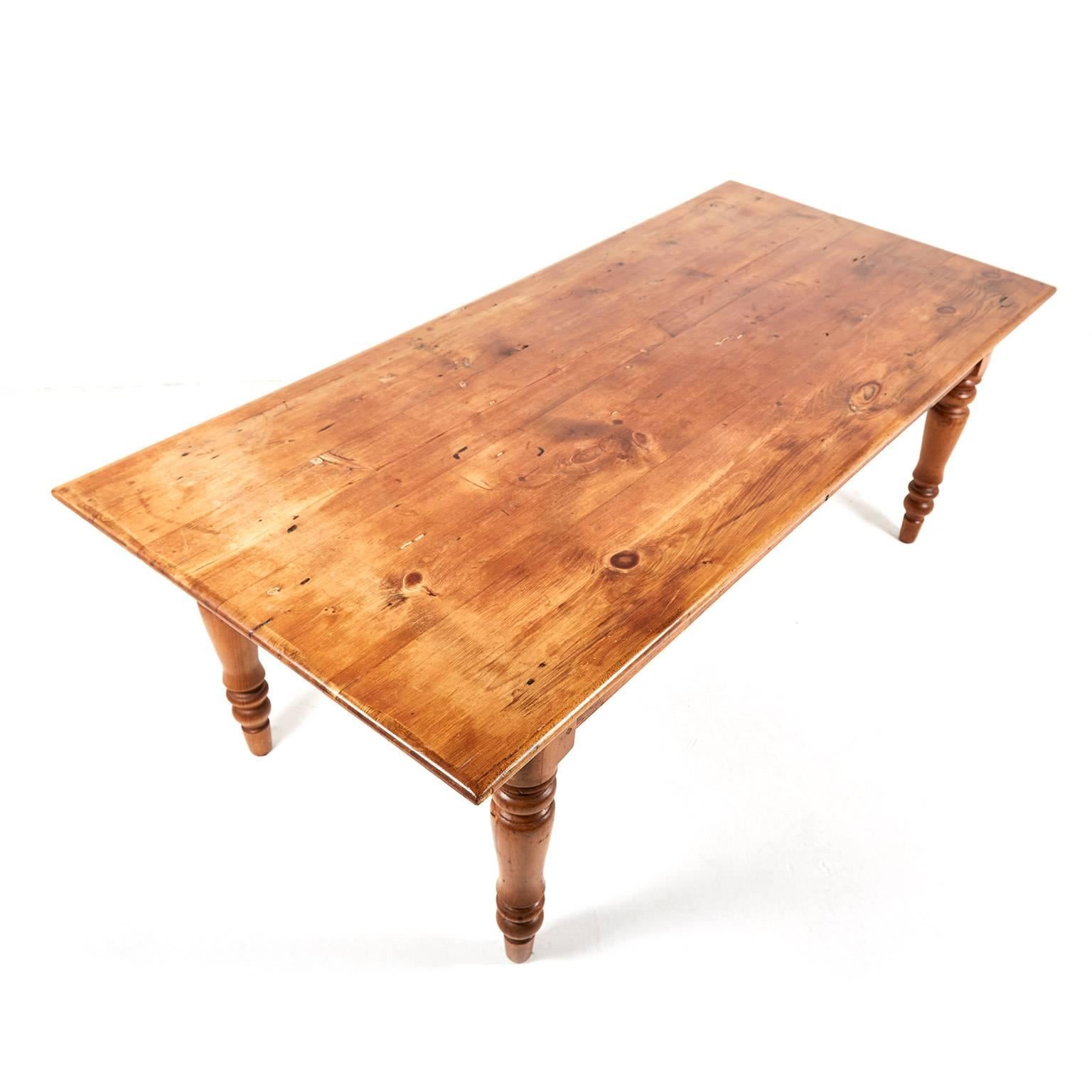 Antique 19th century pine Harvest table. A nice big and sturdy farm table with beautiful color, turned tapering legs, and pegged mortise and tenon joinery. Seats eight comfortably.




 