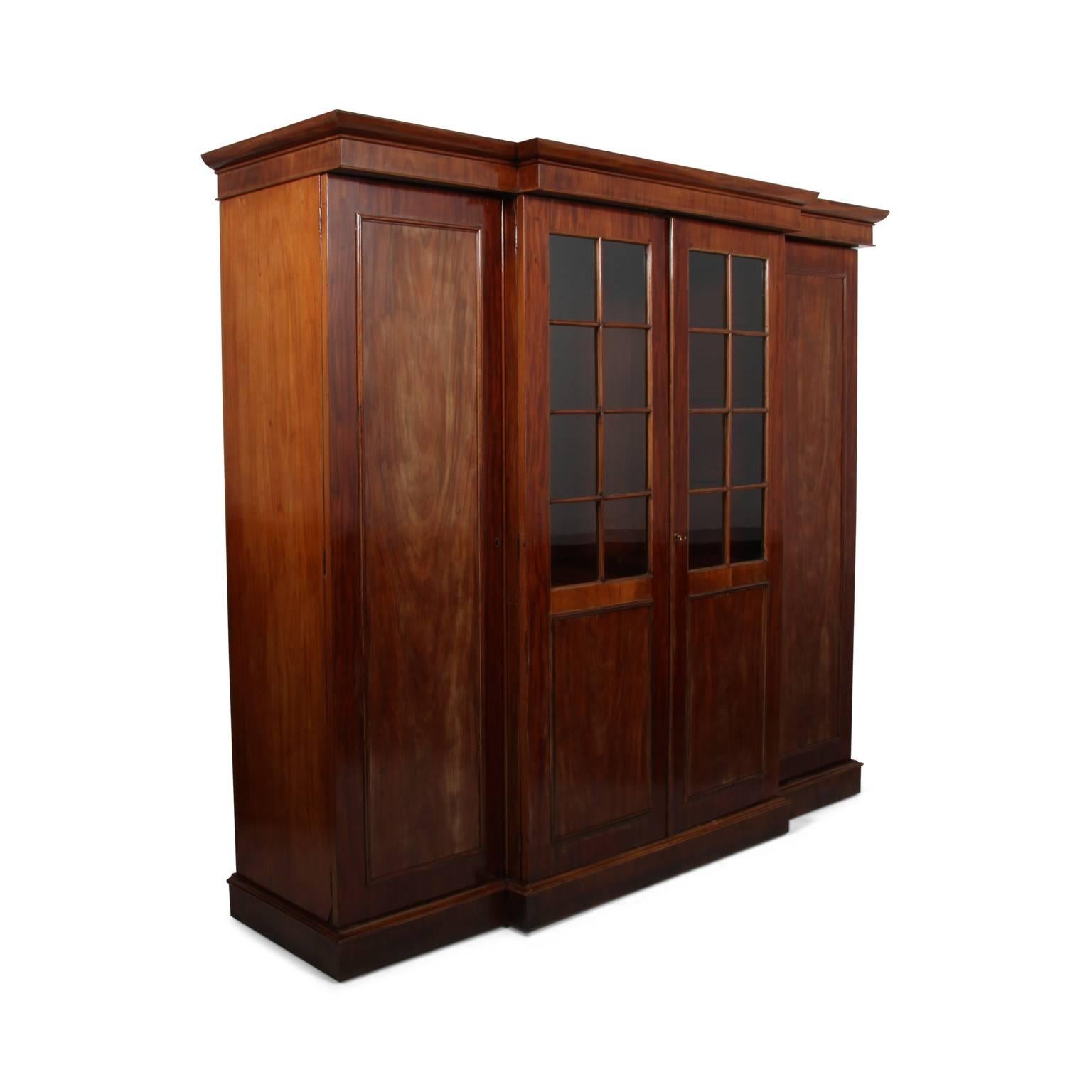 A lovely French mahogany combination wardrobe from the late 19th century. Fitted drawers for ample storage, with striking brass pulls. Original glass in the doors, circa 1880.



 
       