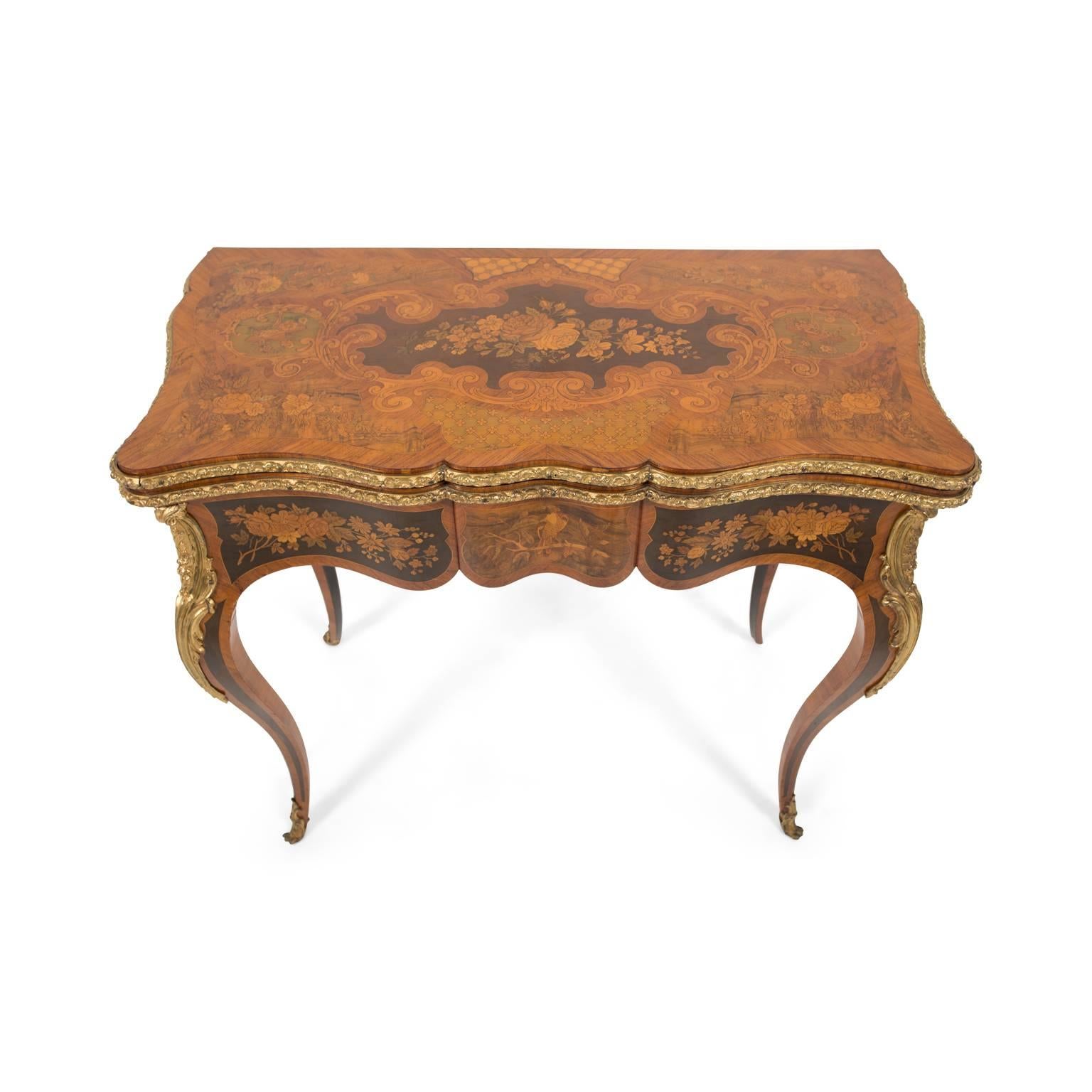 Gorgeous French Louis XV Revival games table with top-quality craftsmanship, classical and detailed gilt mounts, beautifully bowed legs, and highly inlaid surfaces. 

The Jeanselme firm was founded in 1834 and within ten years had acquired the