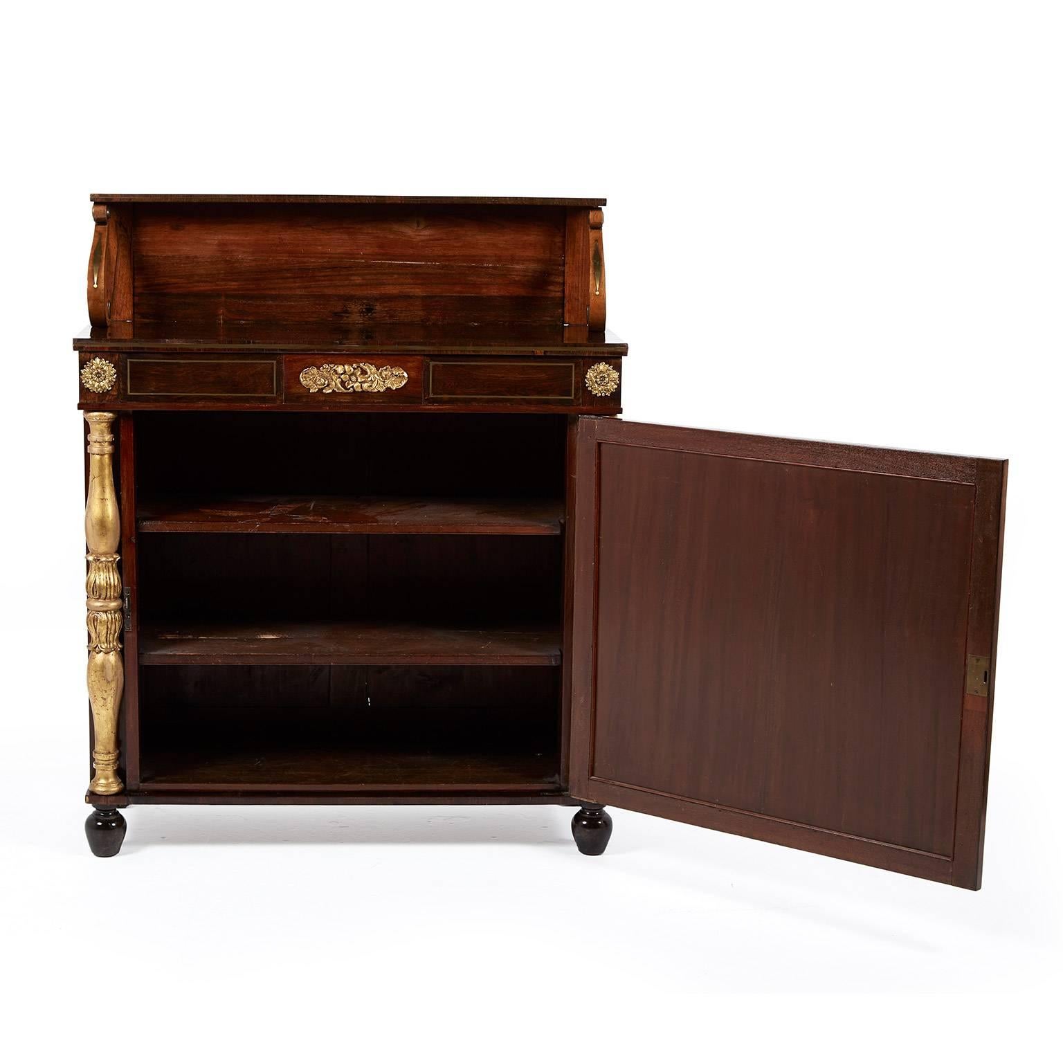 Antique English Regency rosewood chiffonier with brass inlay, ormolu mounts and a striking Wedgewood plaque, circa 1825. Its smaller footprint makes it ideal for any number of different locations in your home.


 