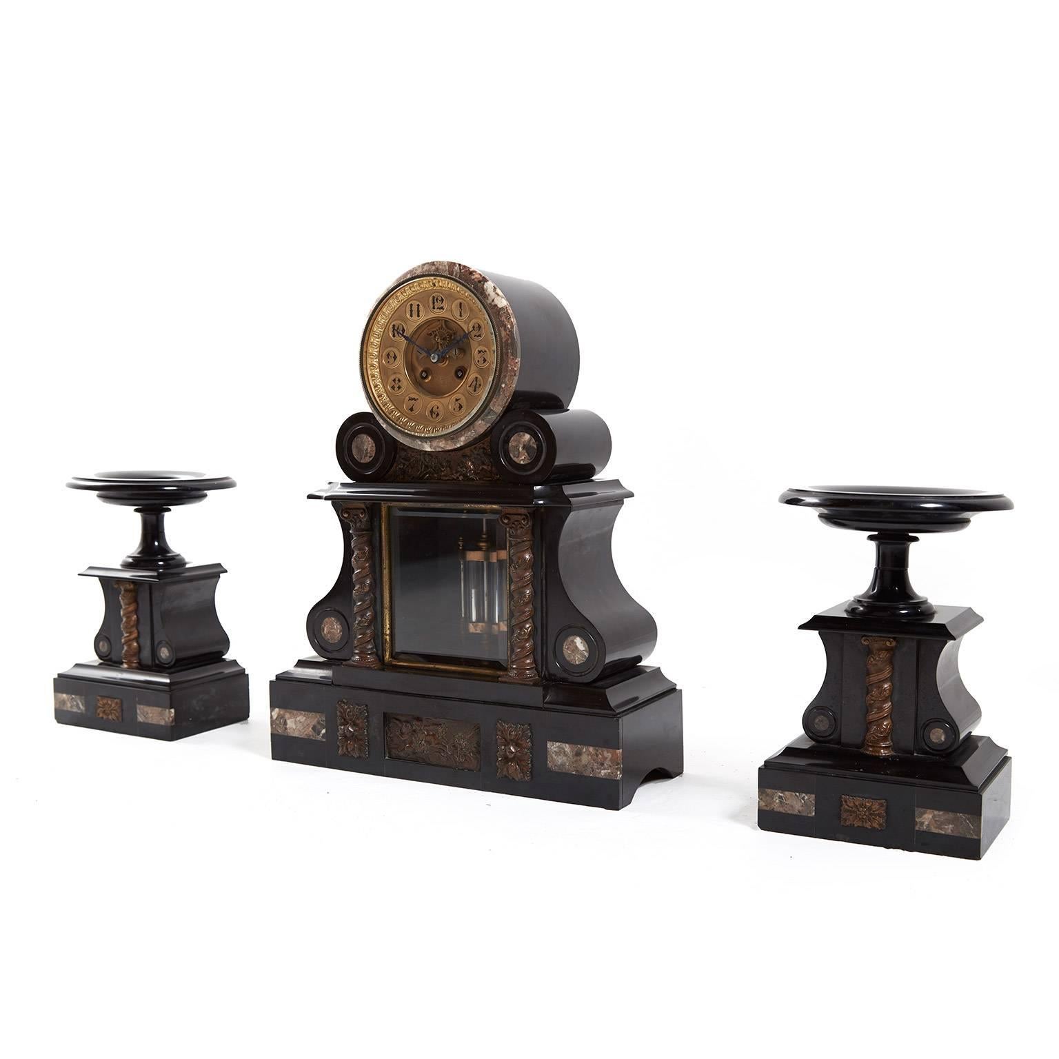 Antique French marble and bronze mantel clock garniture set with two side pedestals, circa 1880.

Measures: Clock 15? wide x 5.5? deep x 19? tall.
Pedestals 7.5? wide x 7.5? deep x 10.5? tall.

               