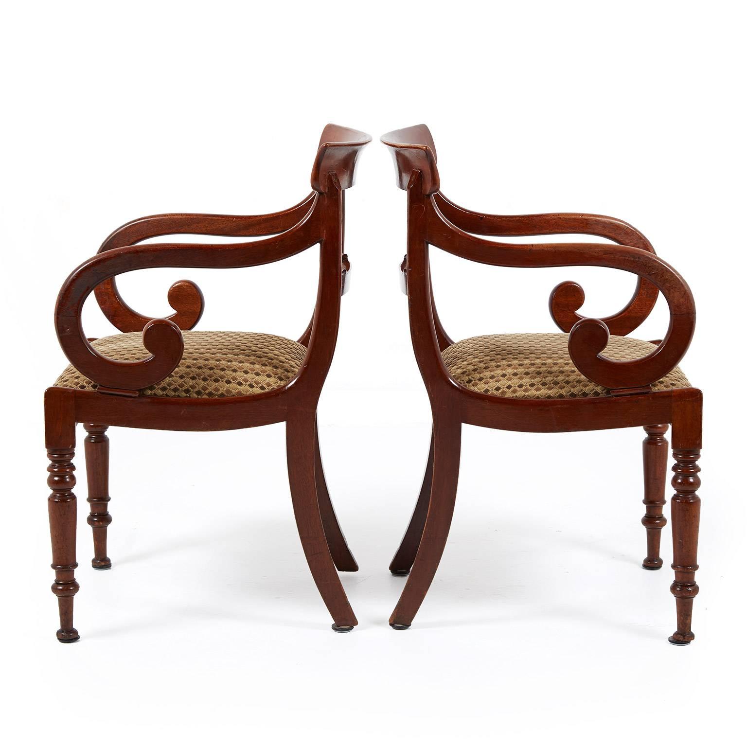 Pair of antique English Regency style mahogany armchairs, circa 1840. Classic lines and solidly constructed ideal for everyday use.



         