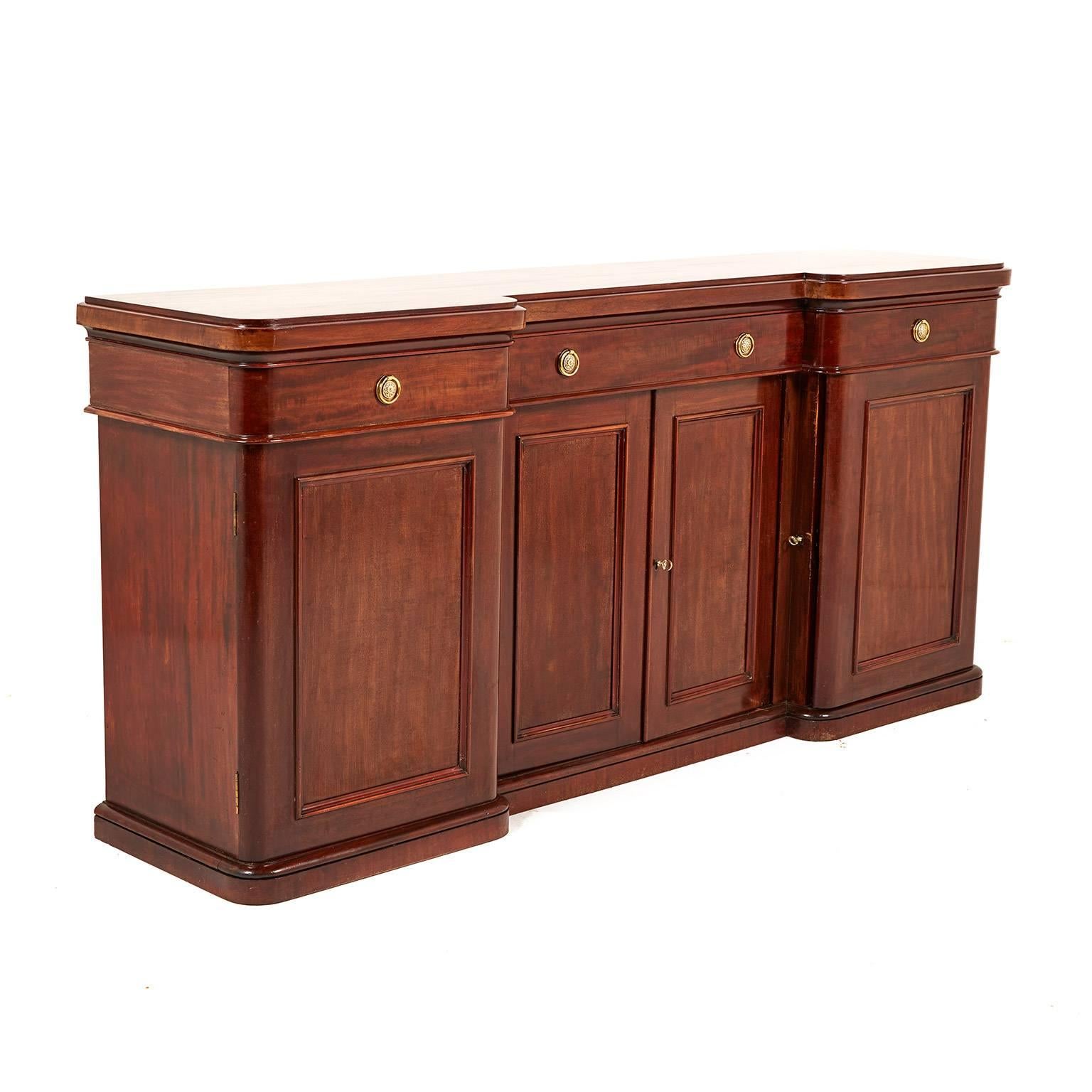 English mahogany four-door sideboard. Elegant lines and beautifully finished. Brass knobs set off the rich patina of the mahogany perfectly. Plenty of storage, too. Works in a number of rooms in the home, circa 1880.


 