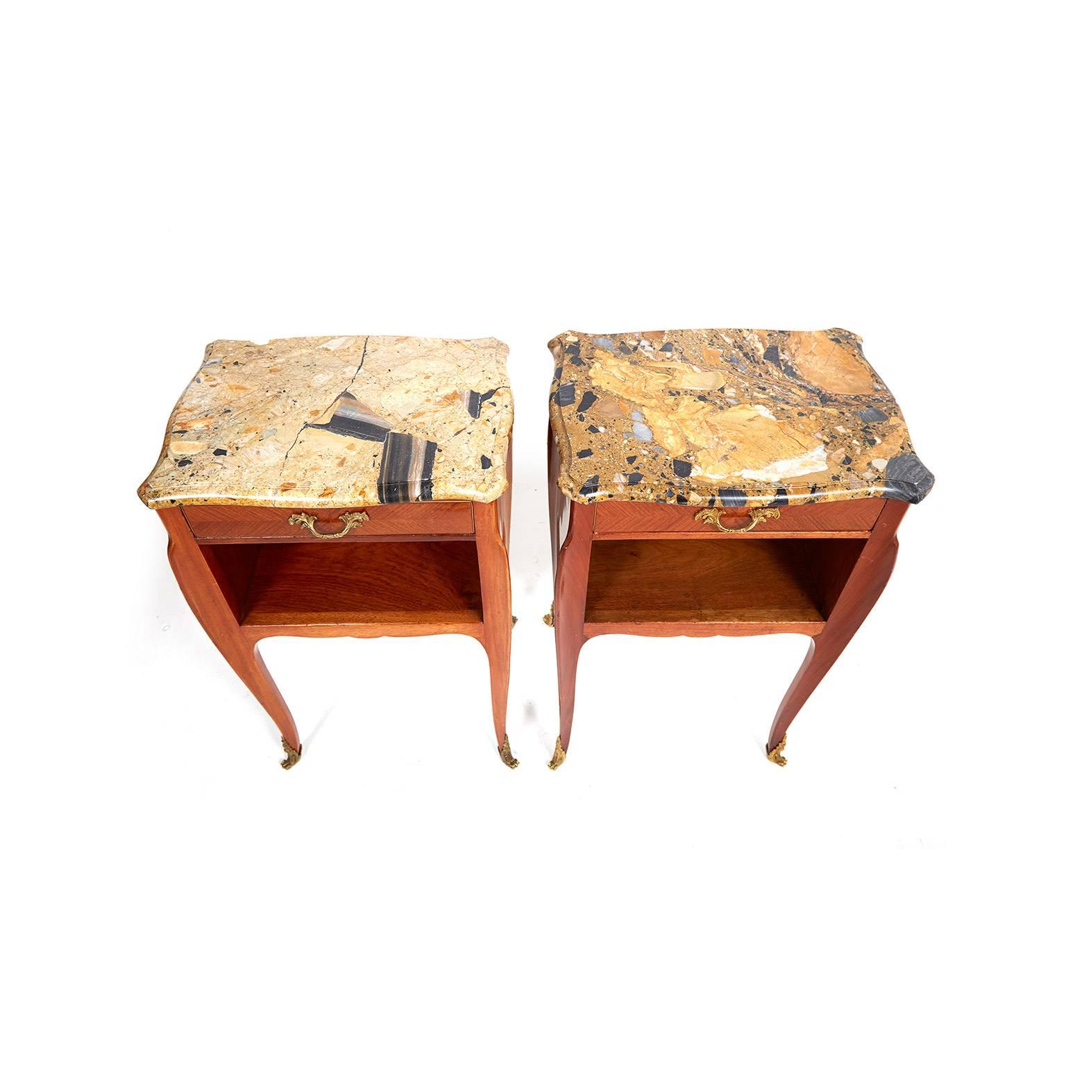Antique pair of French mahogany Louis XV style nightstands, with gilt mounts and gorgeous earthtones marble tops. Finished on all sides, circa 1930.


