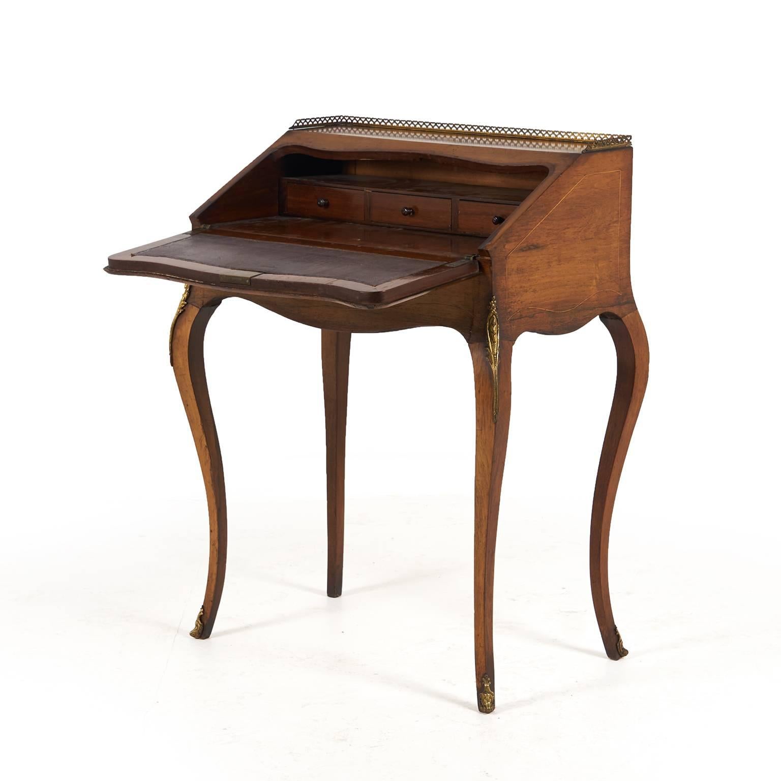 19th century French inlaid drop-front desk with beautiful patina and color and subtle brass accents. Has a hide-away drawer for secret love letters, too!



