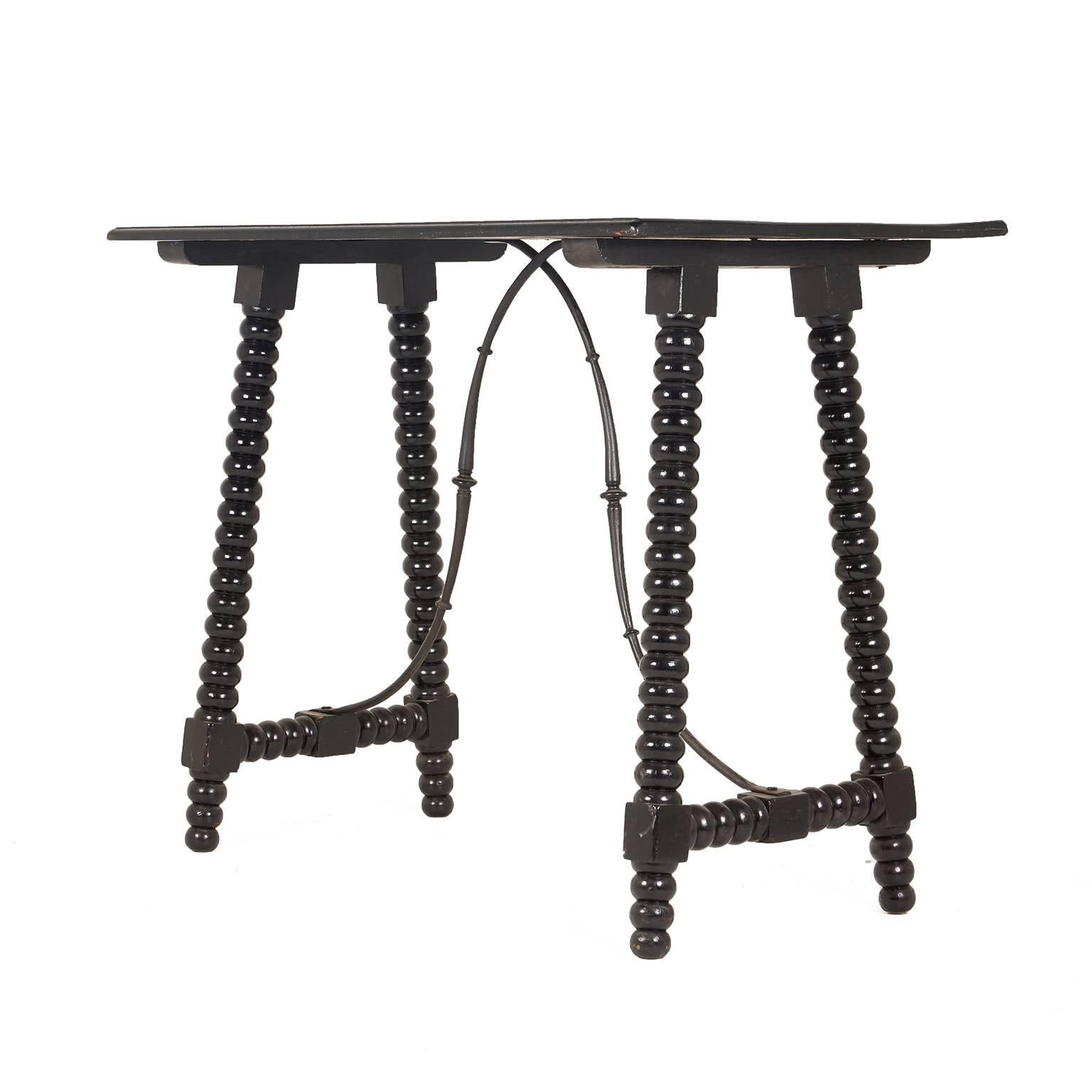 An unusual, small Continental ebonized side or writing, table - with bobbin-turned legs and a wrought iron stretcher, circa 1900-1920.
 

 