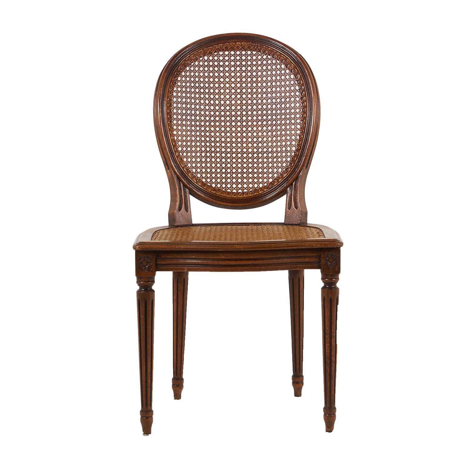 Set of 6 Louis XVI cane chairs with cameo backs. Unusually large, highly decorative, with caning in perfect condition. A good choice for everyday use.





