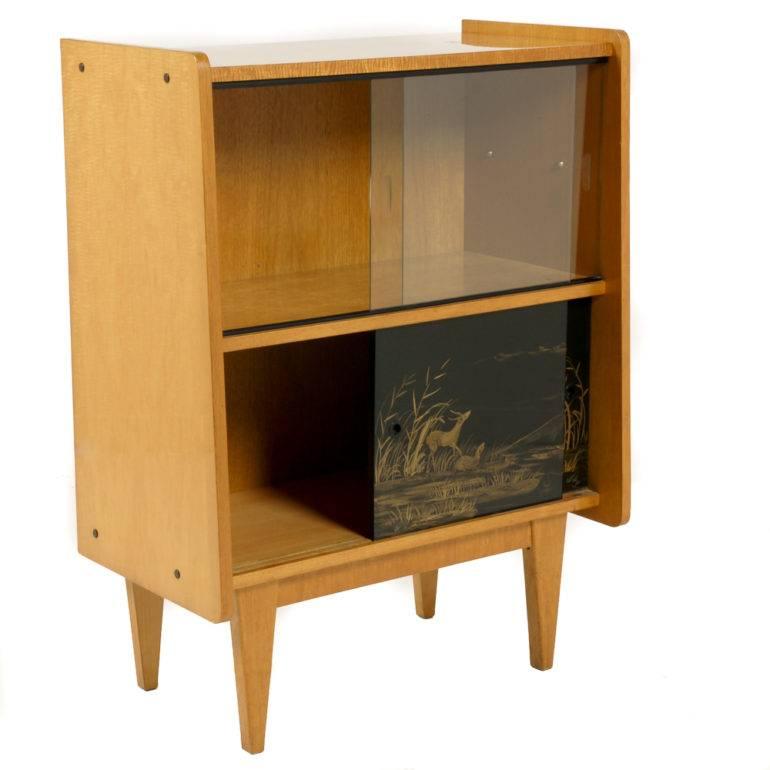 A match to the French Mid-Century Modern buffet, this 1950’s piece is in exceptional original condition – visually striking with boldly contrasting bird’s eye maple and dark lacquer. Circa 1950.



