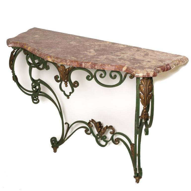 A French console table consisting of an elegantly-formed Louis XV-style wrought iron base and a serpentine-shaped marble top, circa 1930.



 