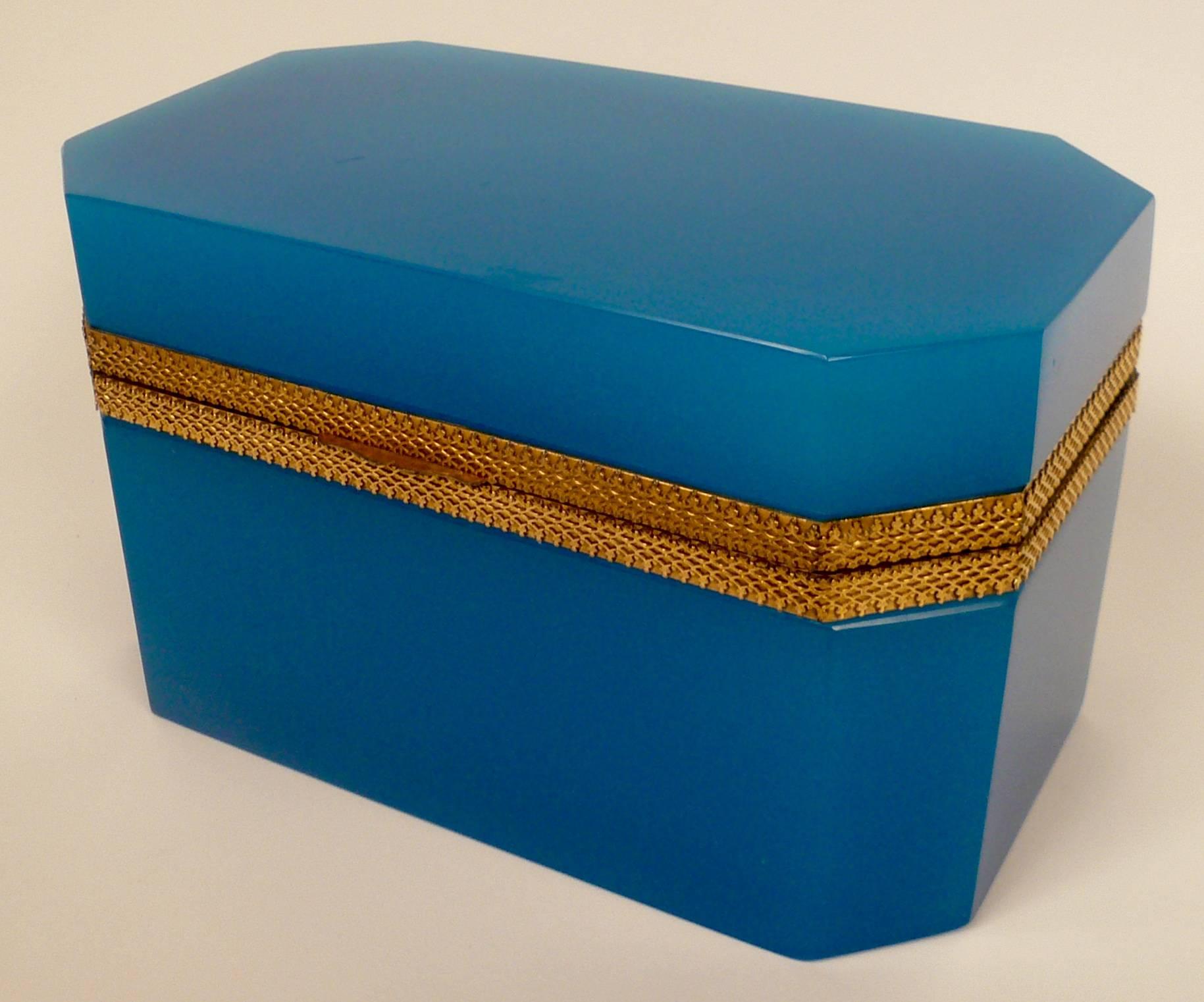 This large box, or casket in blue opaline glass is mounted in gilt bronze.