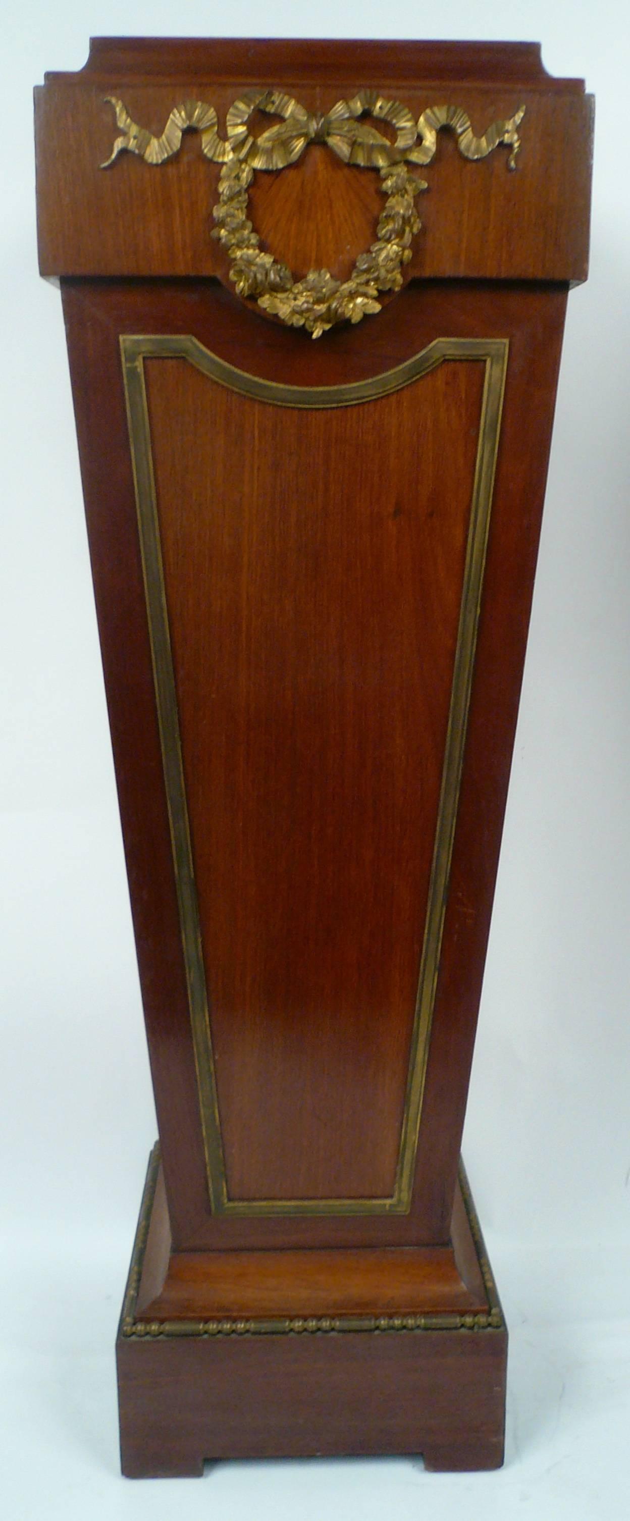 This finely proportioned pair of inlay mahogany stands, with bronze mounts date from the early 20th century.