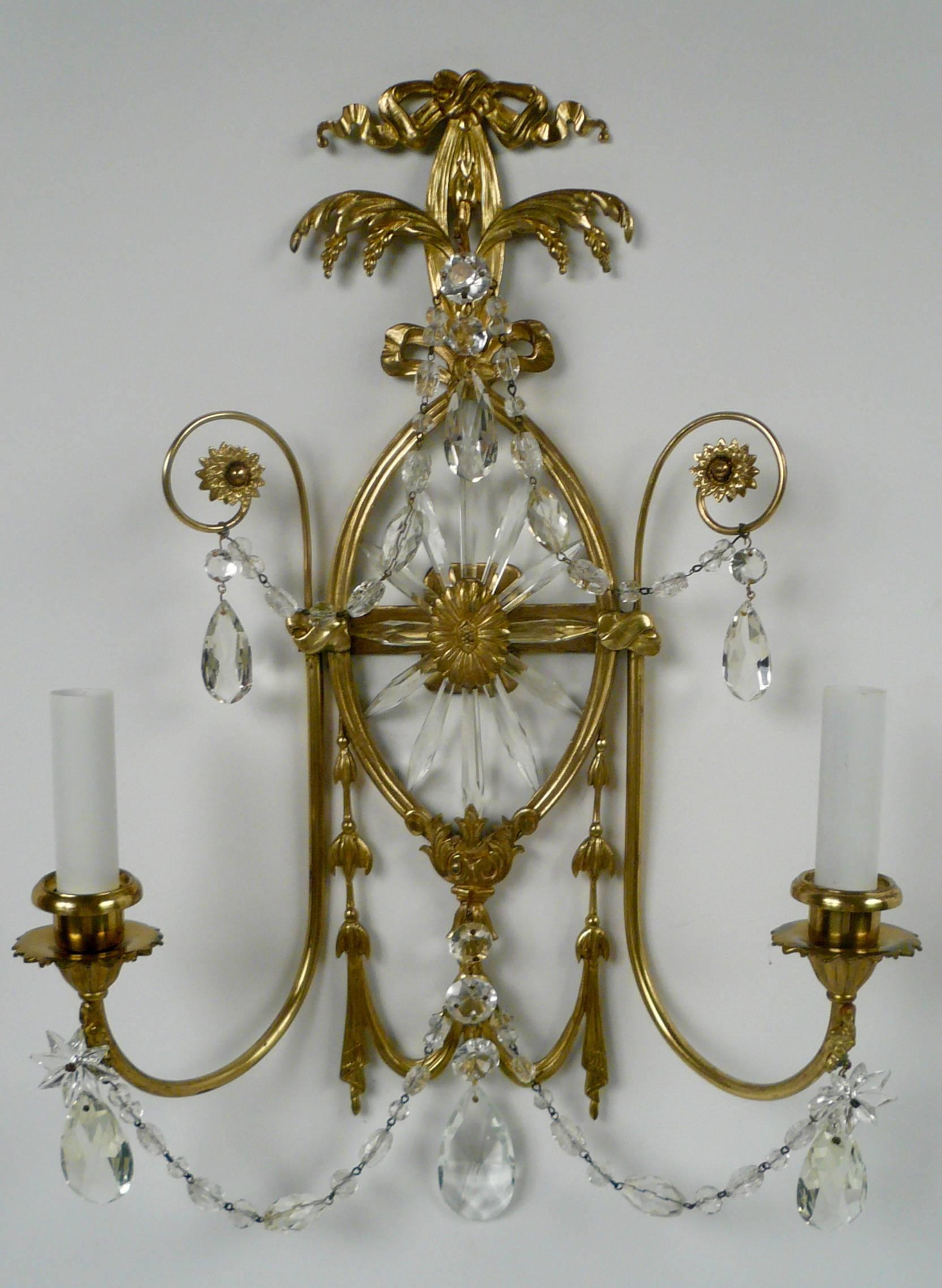 This pair of neoclassical style sconces with a Robert Adam design influence are well proportioned and in fine condition.