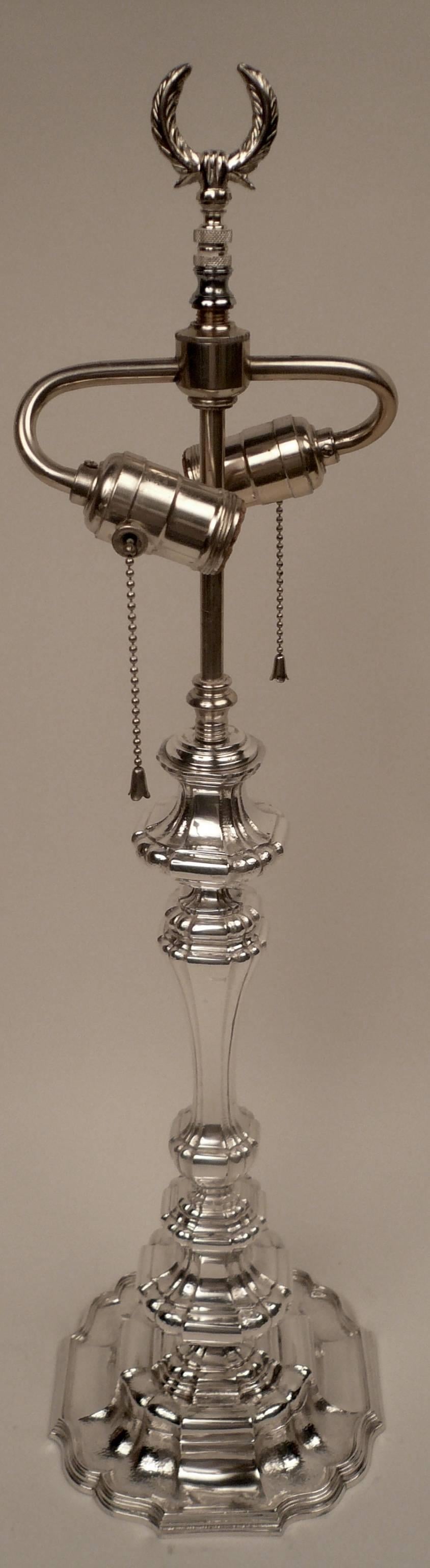 This Caldwell quality early Georgian style lamp retains it's original finish and is in Fine condition. It is of generous proportion, and features hand-hammered elements.