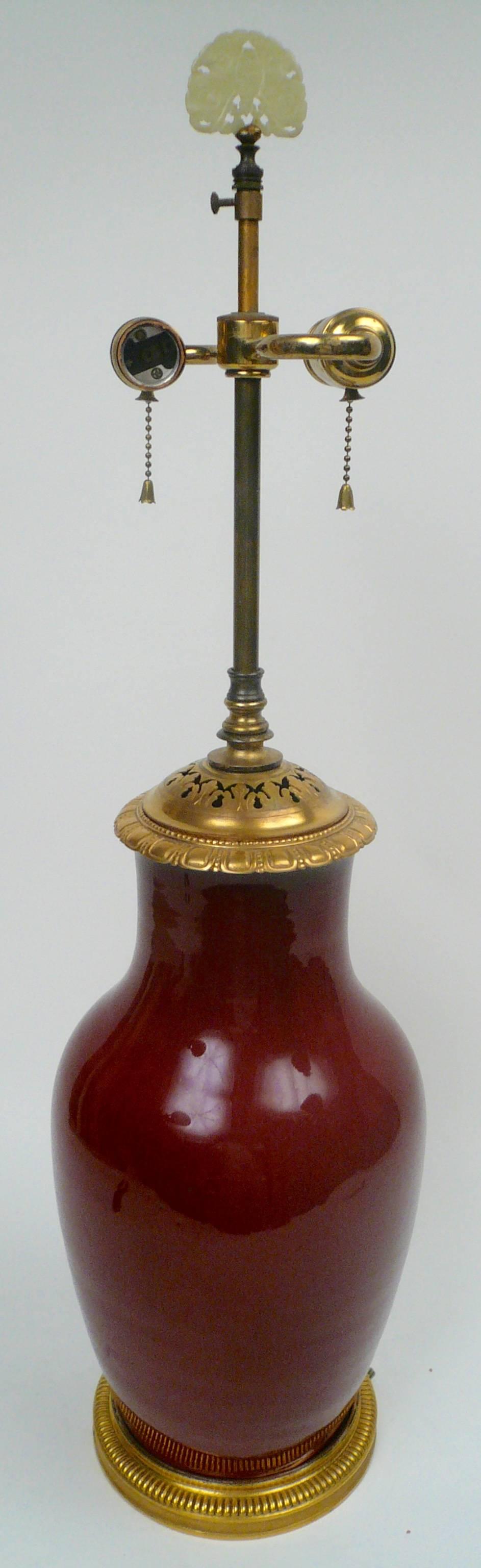 20th Century Chinese Sang de Boeuf Porcelain and Gilt Bronze-Mounted Lamp