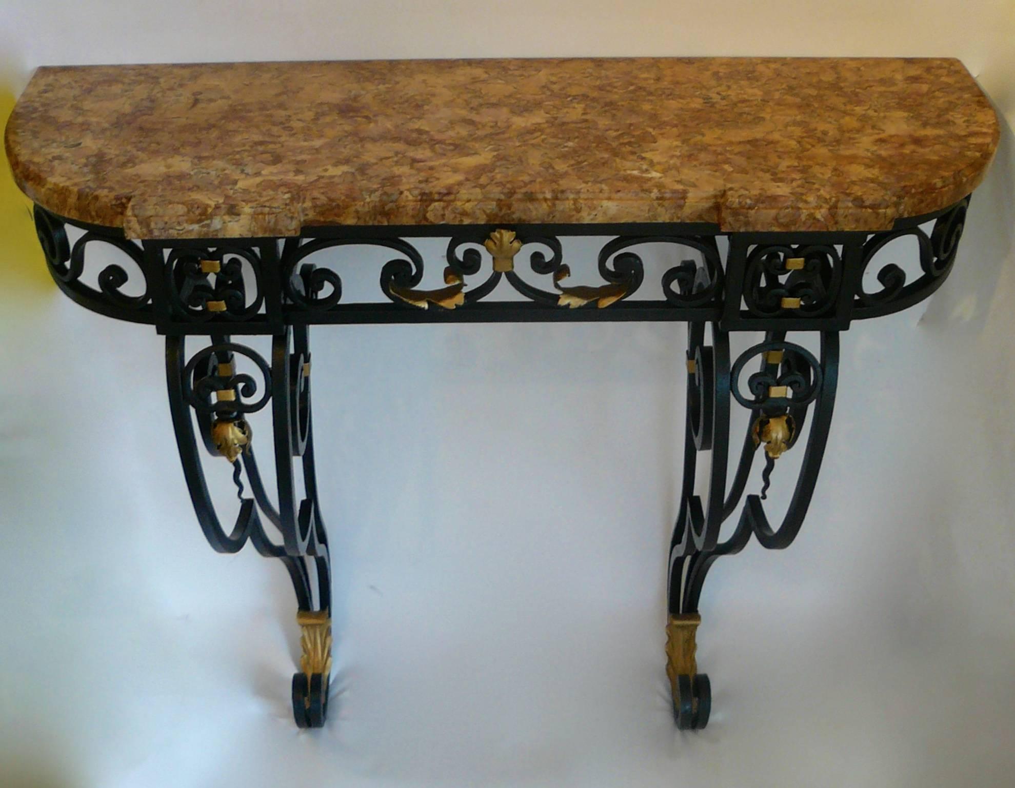 This neoclassically inspired console table is wrought of heavy gauge iron and retains it's original marble top.
