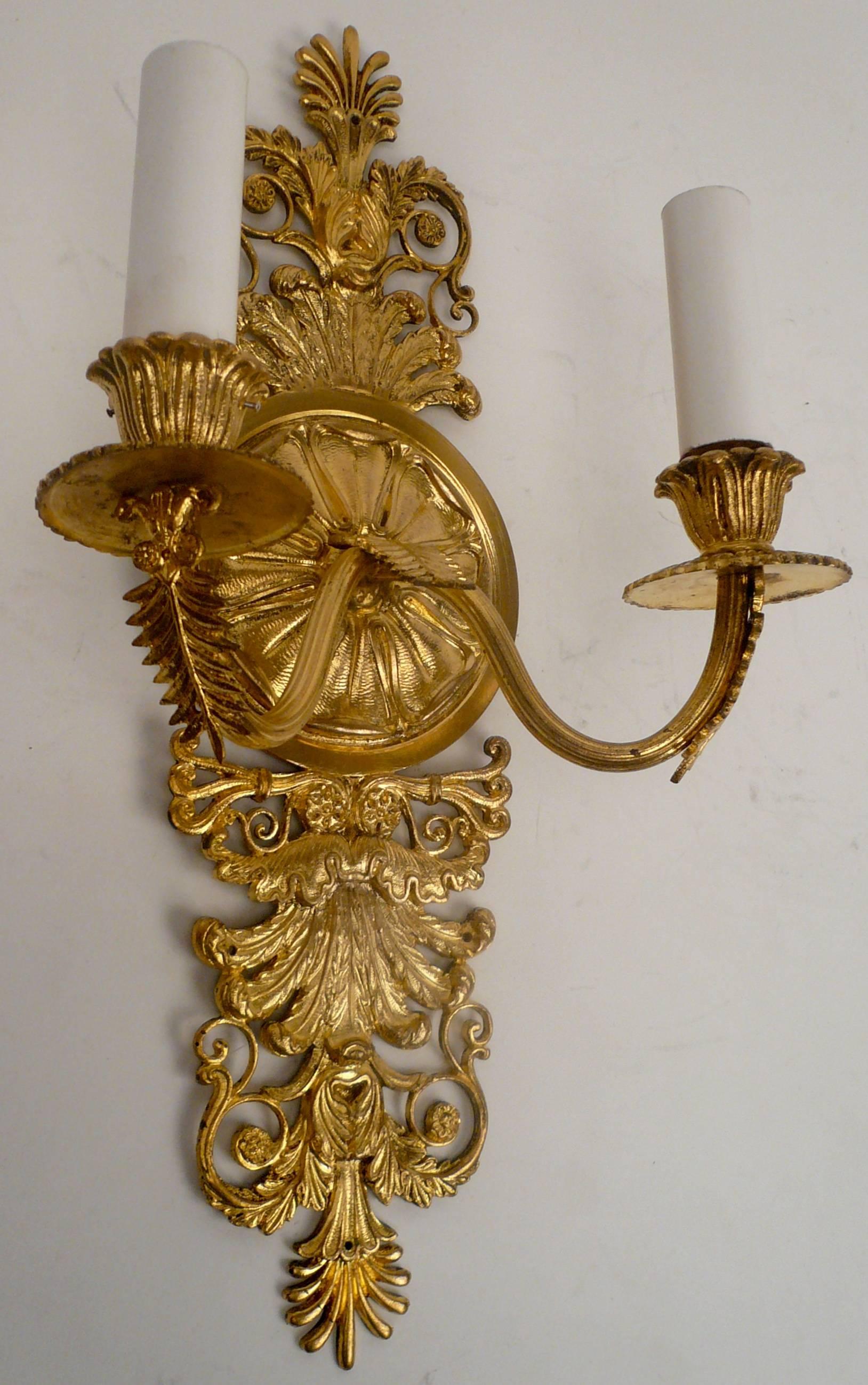 This pair of two-light neoclassical style sconces are well cast and finely detailed. They are newly wired, and ready for use.