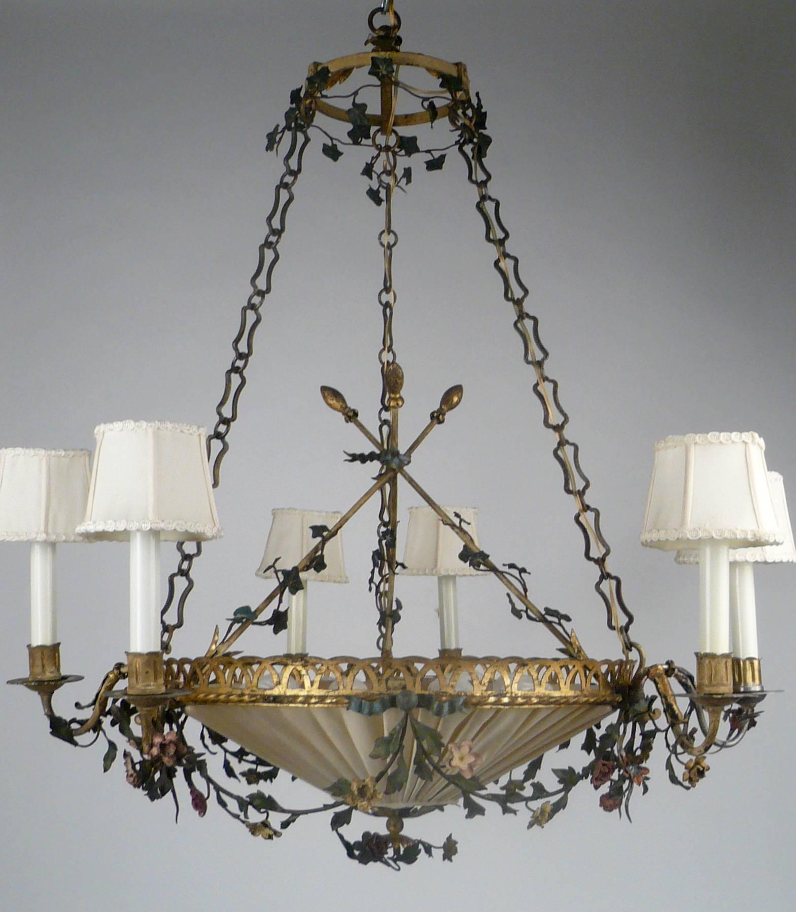 This Country French, Louis XVI style tole chandelier has six arms, and six interior lights.