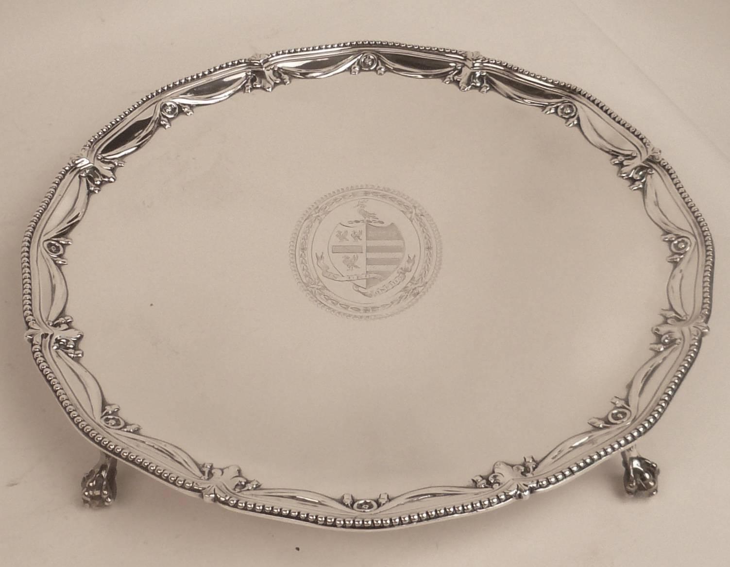 This large footed salver by John Carter is finely executed in sterling, and engraved this motto 