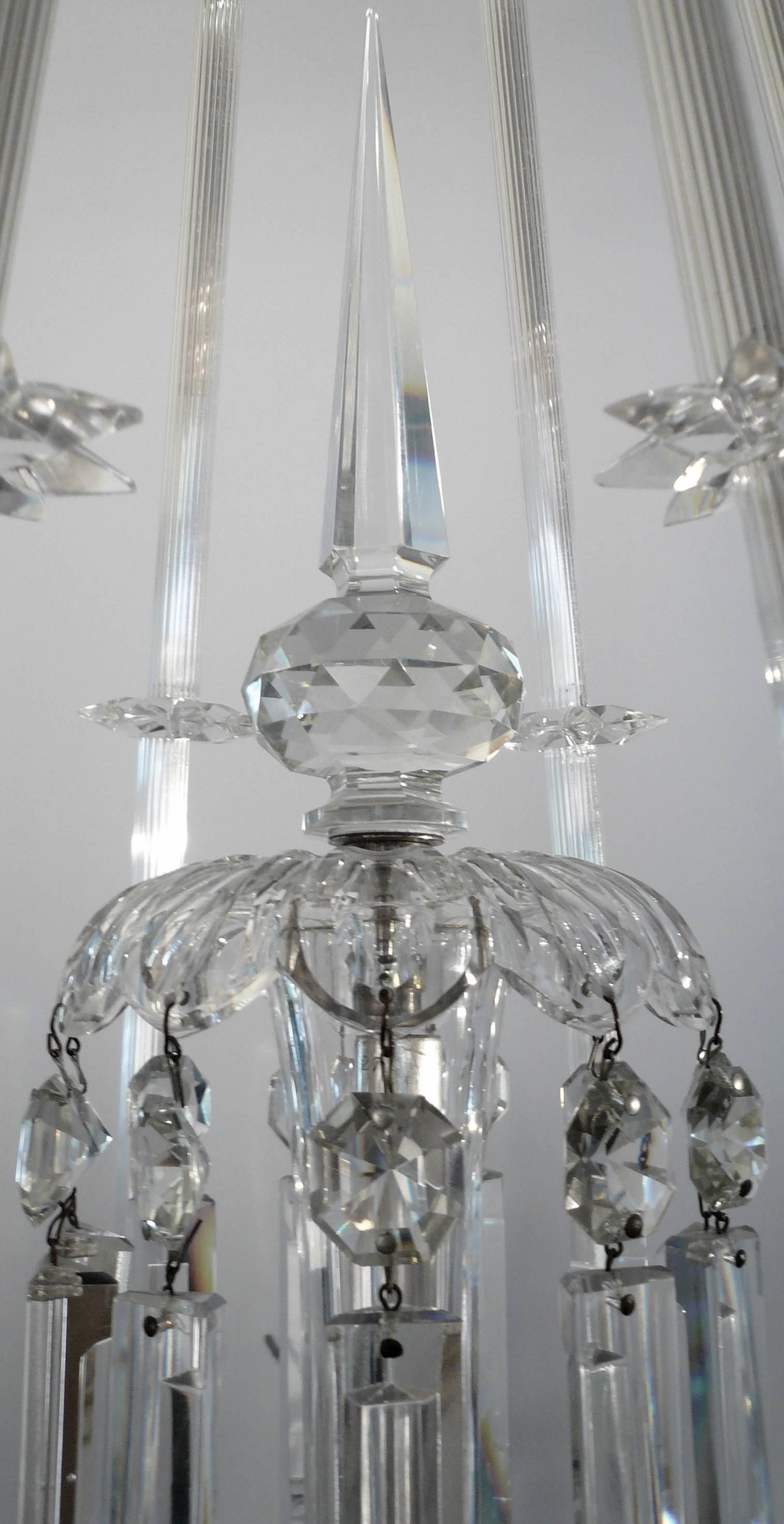 This six light chandelier by the renowned firm of F & C Osler, is of rare design and a first rate example the the glass cutters art! Originally gas powered, this fixtures design seems to foreshadows Art Deco and midcentury forms.