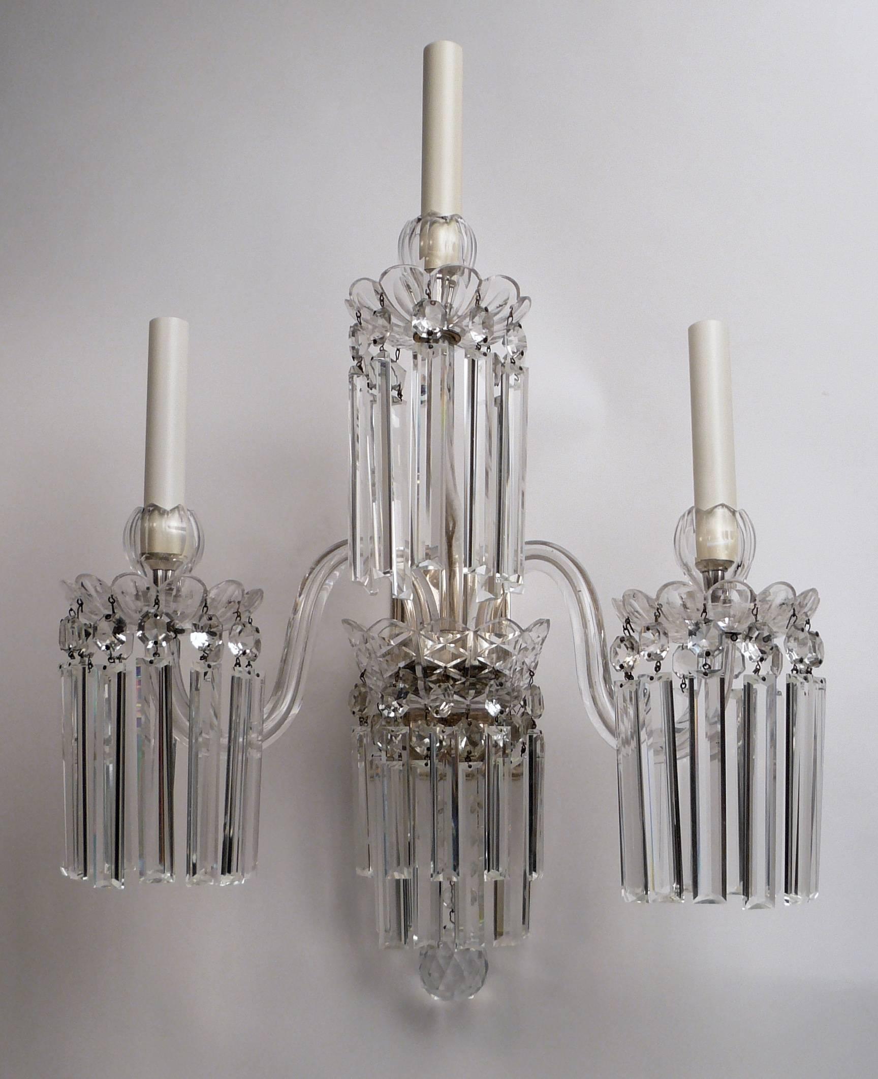 Originally gas powered, these impressive sconces feature finely cut crystal 'Osler' bobeches, rule cut prismatic drops, and silver plated fittings. Newly rewired, these sconces are ready for use.

      
