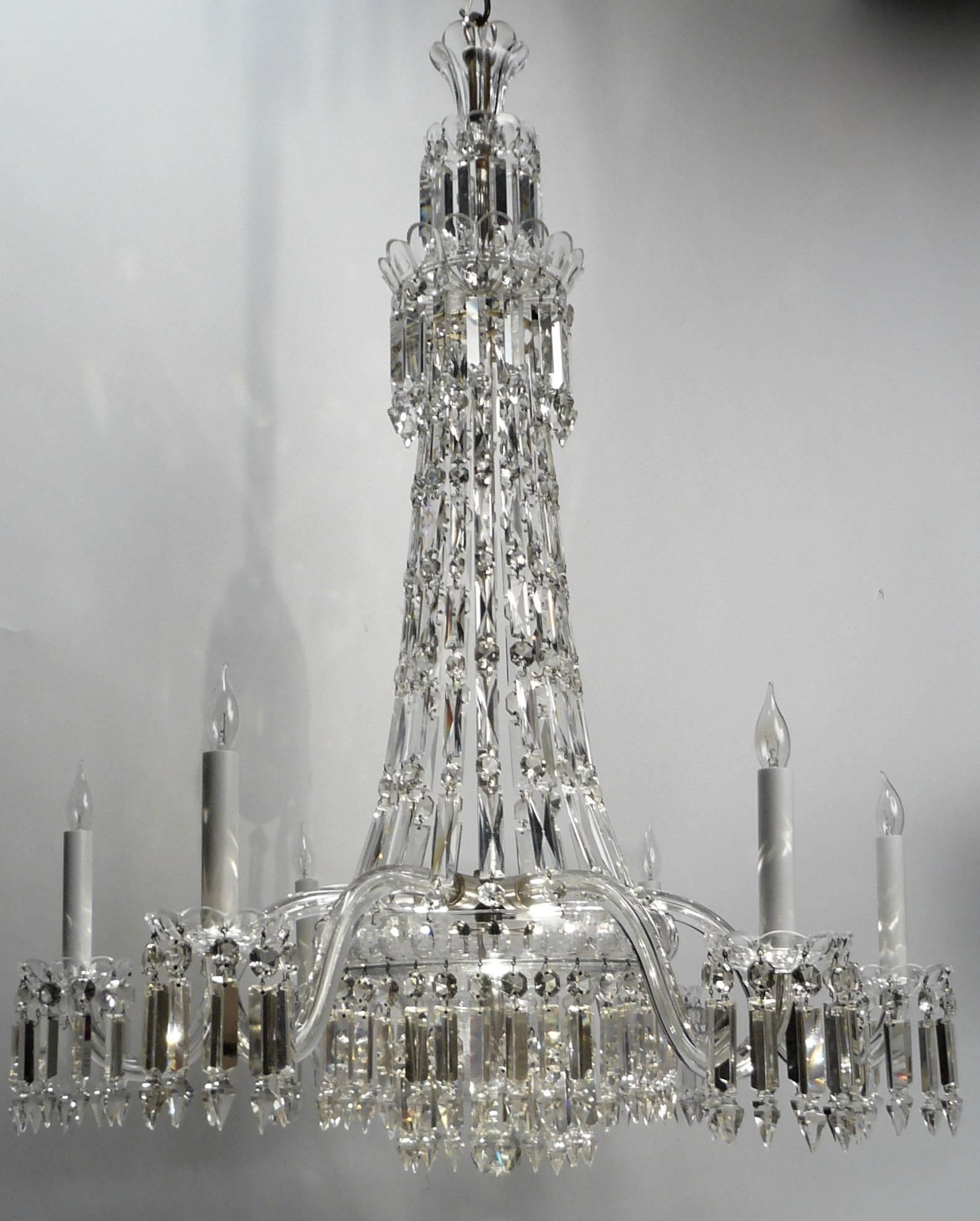 This fine six-arm chandelier by the renowned firm of F & C Osler is of 'tent and bag' form, which was popular in the Regency and early Victorian periods. Originally gas powered, it features spear point, or Albert prisms, named for Prince Albert. The