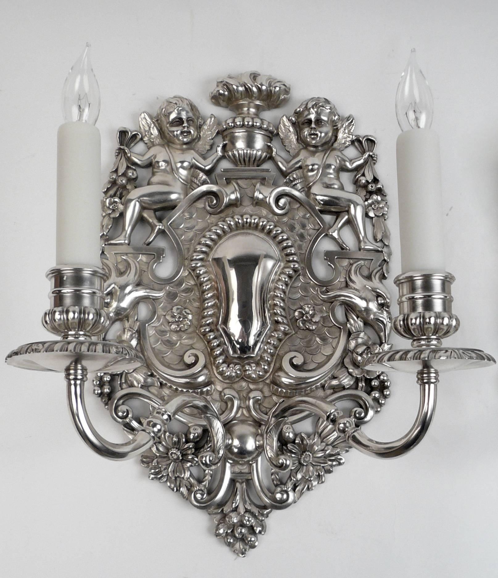 These finely detailed William and Mary style sconces are after a model by London silversmith John Rand, dated 1703.